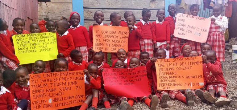 Group of young kids holding placards
