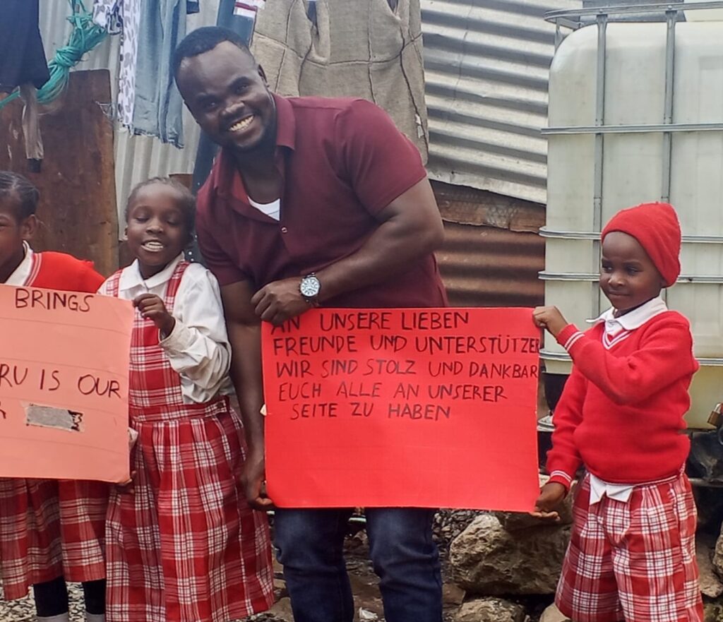 Group of young kids and Dalmas holding placards