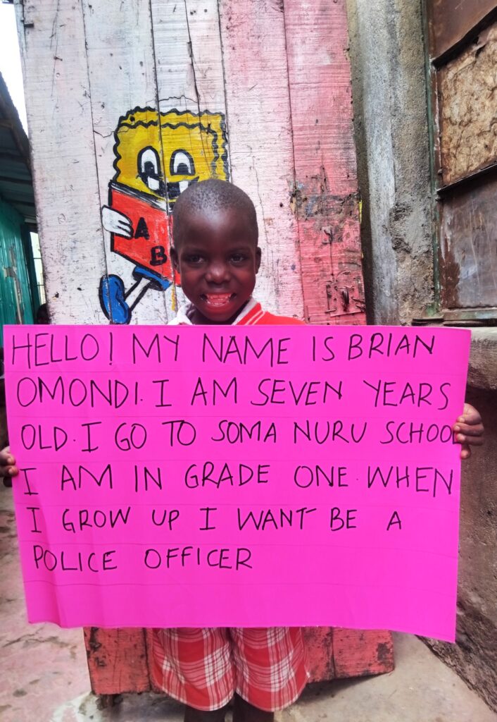Young boy holding a placard