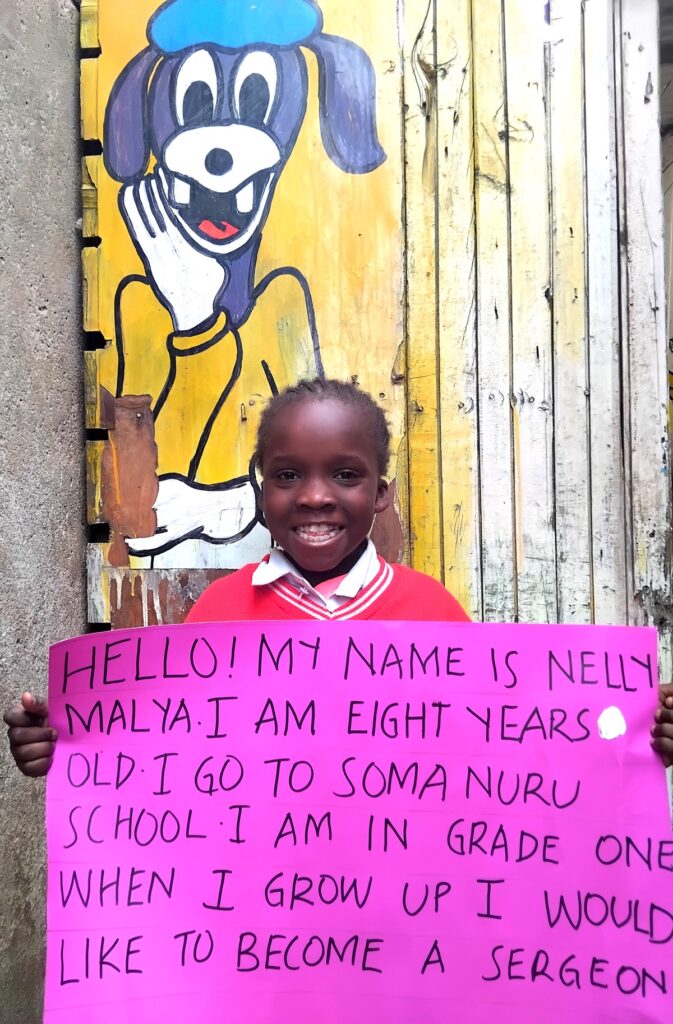 Young girl holding a placard